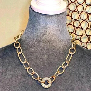 Necklace- Silver chain link with crystal donut centerpiece.